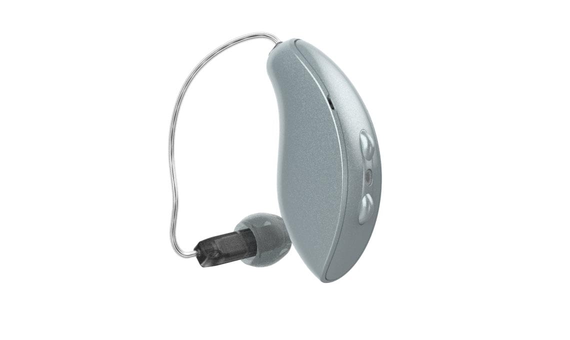 Silver behind-the-ear hearing aid with clear wire and black receiver tip on a white background